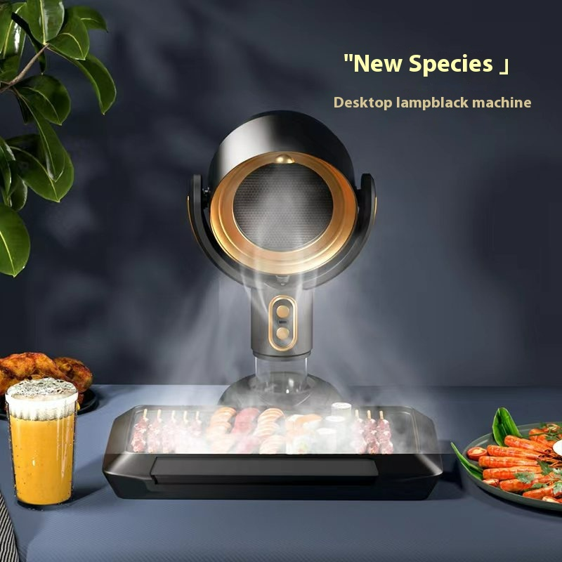 Black and gold countertop smoke extractor positioned above a tabletop grill