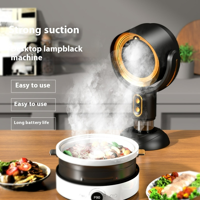 Black and gold countertop smoke extractor drawing steam from a cooking pot